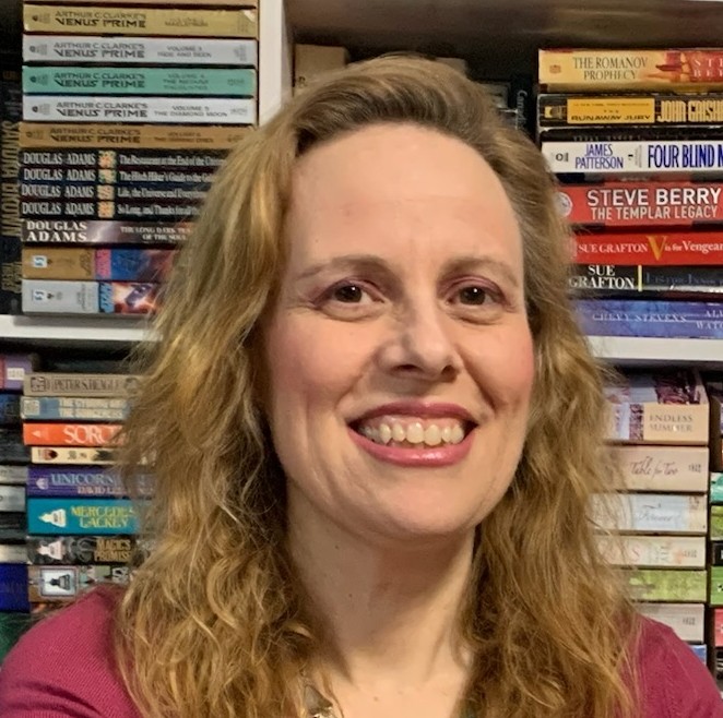 Kelly Picard Headshot in Library